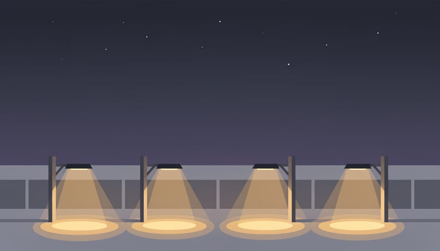 Shielded warm outdoor light casting a controlled pool of light onto a pathway at night